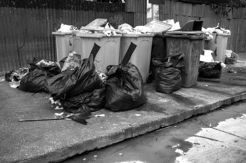 Forest Gate Skip Hire branded skip outside a residential property being loaded