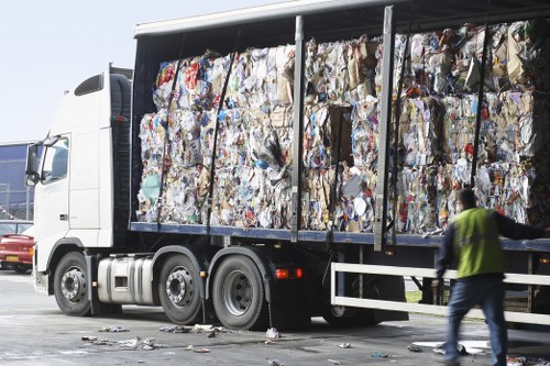 Professional waste removal team handling construction debris