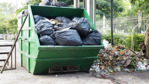 Workers managing construction waste materials